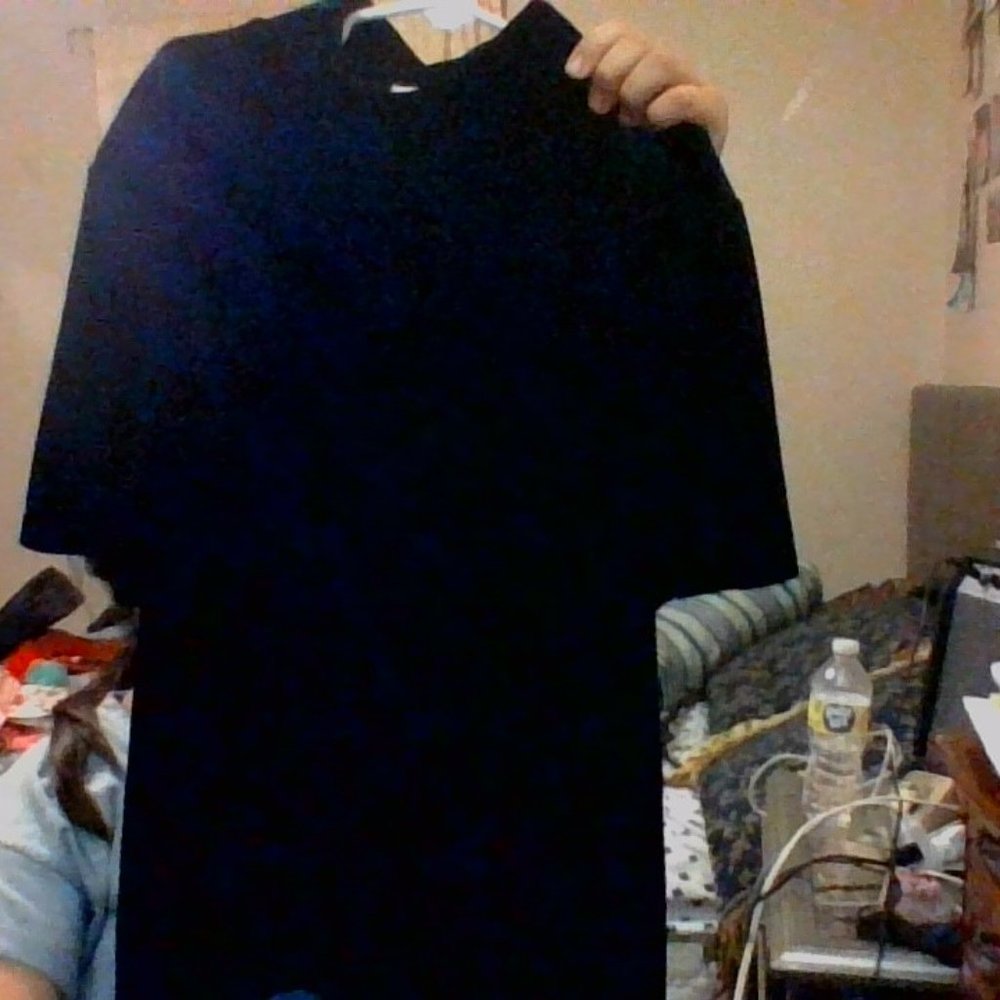 Fuzzy black turtle neck shirt.